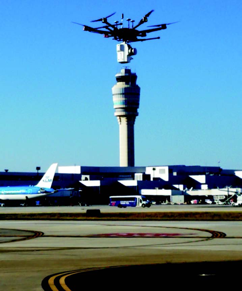 Figure 4. A Headwall UAV based on the DJI Matrice 600 Pro, equipped with a Co-Aligned VNIR-SWIR sensor and LiDAR, scans a runway with permission at Hartsfield-Jackson Atlanta International Airport..